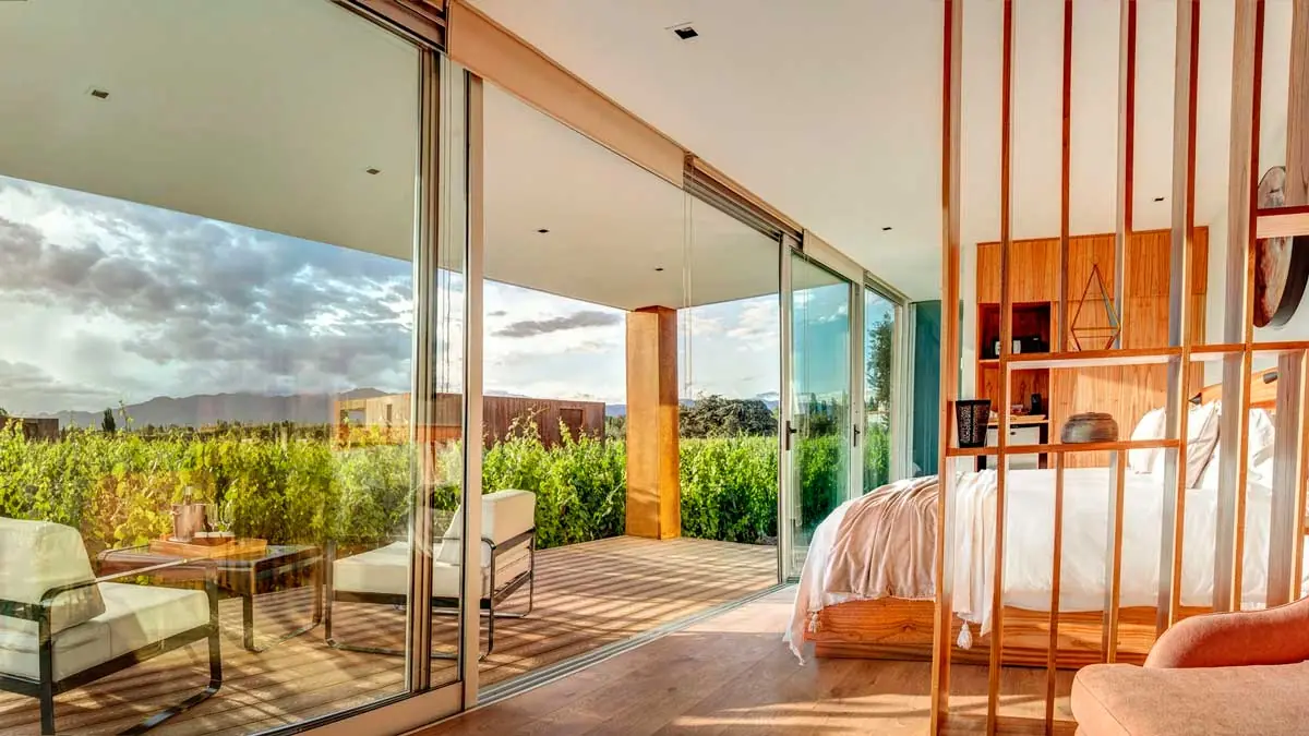 Room at Entre Cielos Mendoza, panoramic windows with vineyard and Andes views