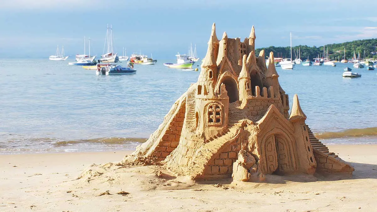 Sand castle at Buzios resort, beach and sea in Brazil