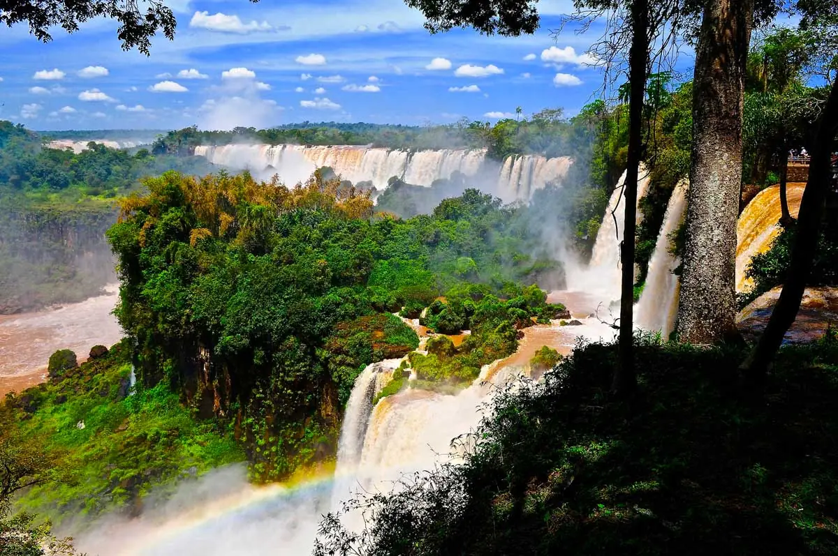 Powerful water flows at Iguazu Falls in Brazil and Argentina, cascades and spray