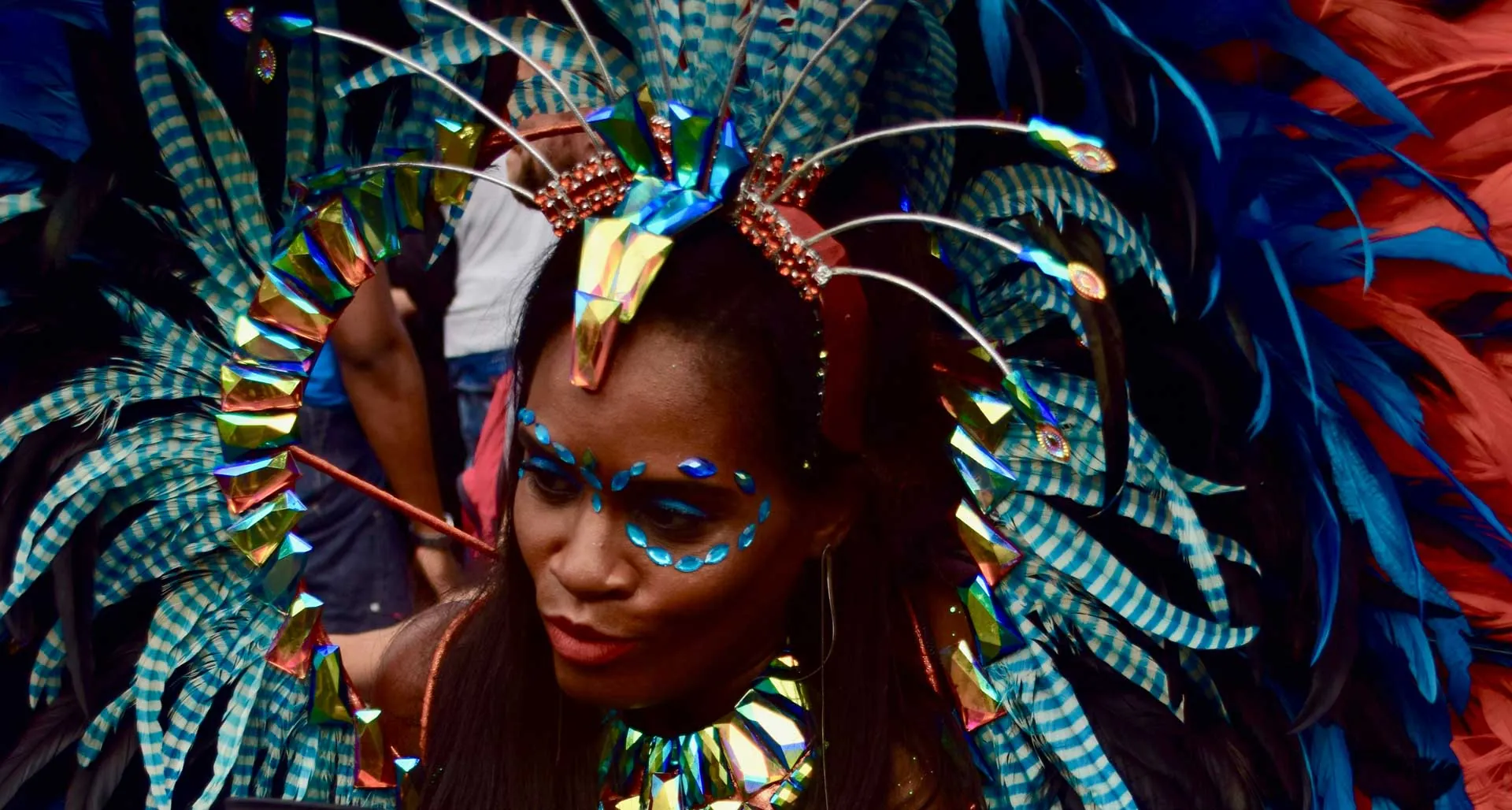 Bright feathered carnival costume on a girl in Rio de Janeiro