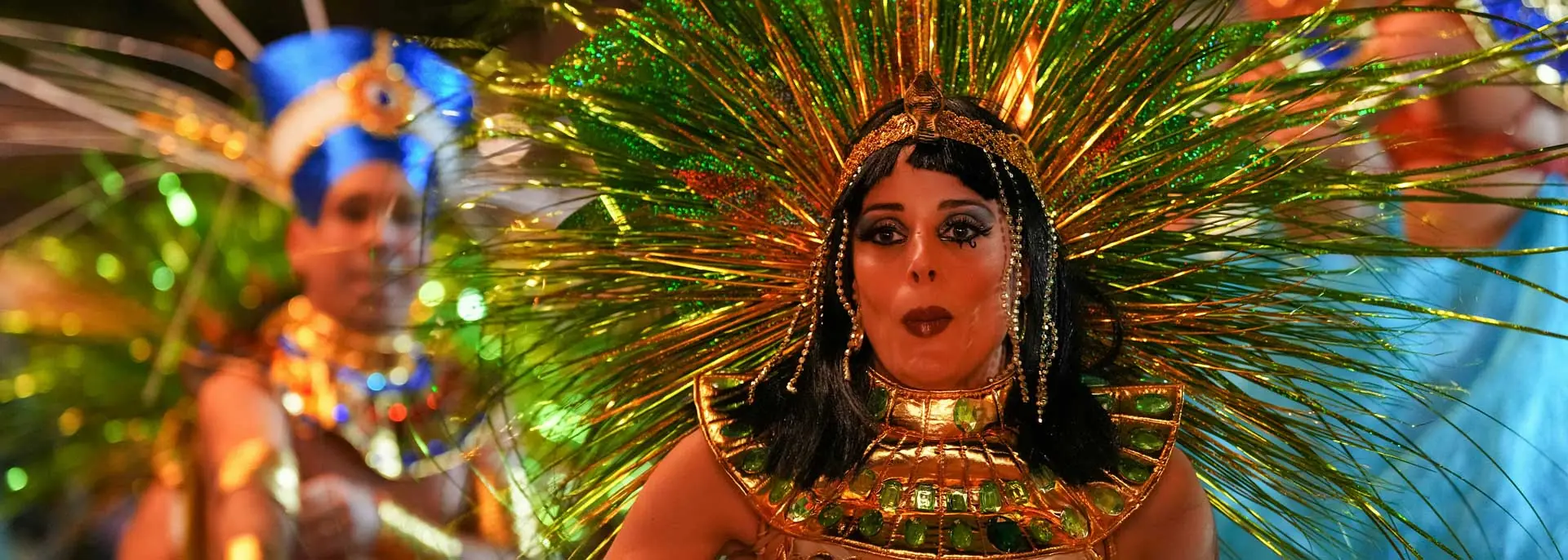 Girl at the carnival in Brazil, bright costume with feathers and glitter in Rio