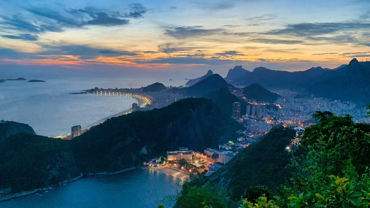 Panorama of night Rio from the cable car, city lights and Guanabara Bay