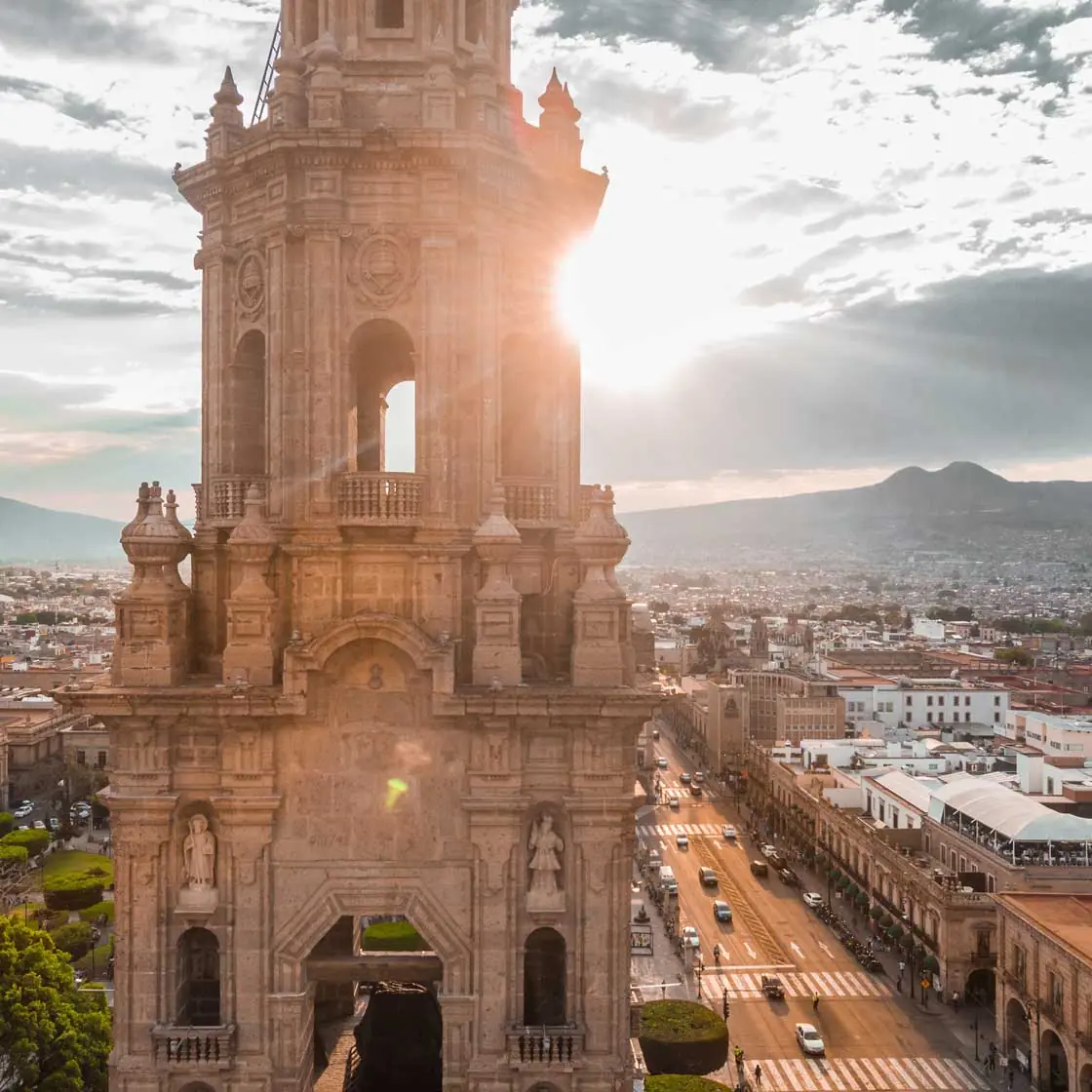 Sunset over downtown Mexico City, aerial panorama and colonial buildings