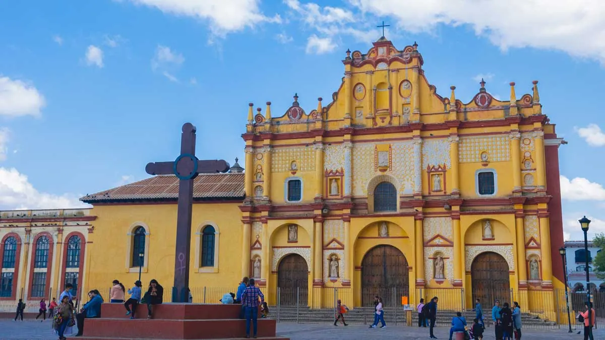 Yellow-orange facade of San Cristóbal de las Casas Cathedral at sunset
