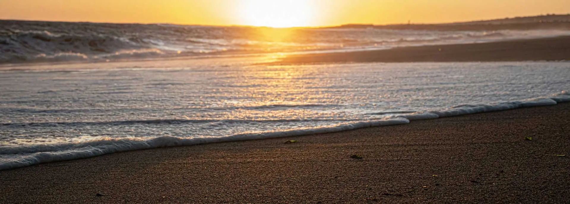 Sunset on Uruguay coastline, Atlantic beaches, golden sand and ocean waves