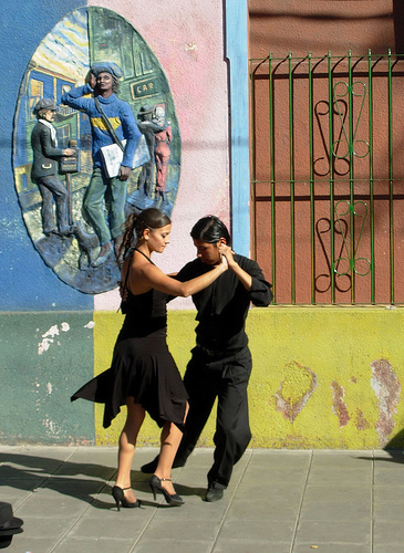 In  photo: a couple dancing an Argentine tango