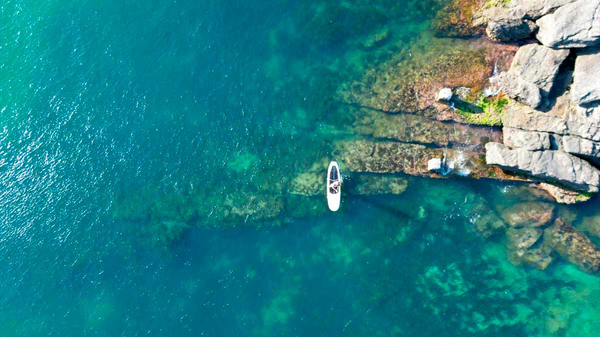 Panoramic view of Buzios peninsula with turquoise water and sailboats – luxury beach vacation