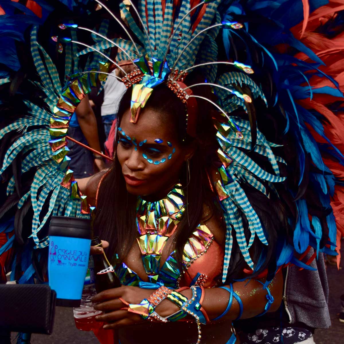 Bright feathered carnival costume on a girl in Rio de Janeiro