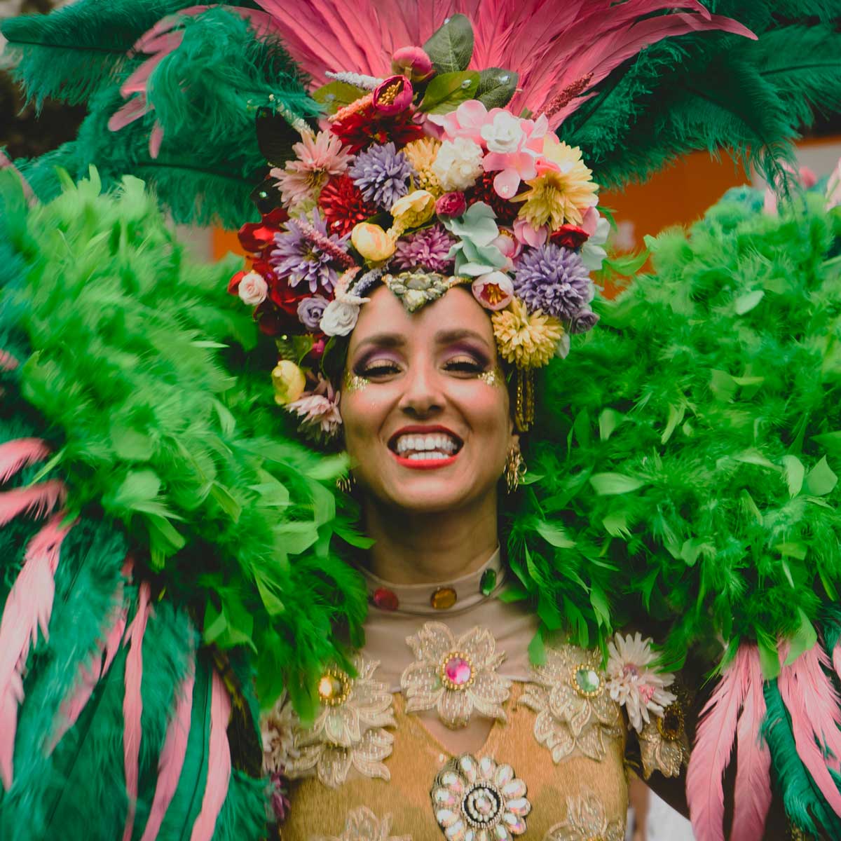 Girl in feathered costume at the Rio Champions Parade, joy and Brazilian carnival