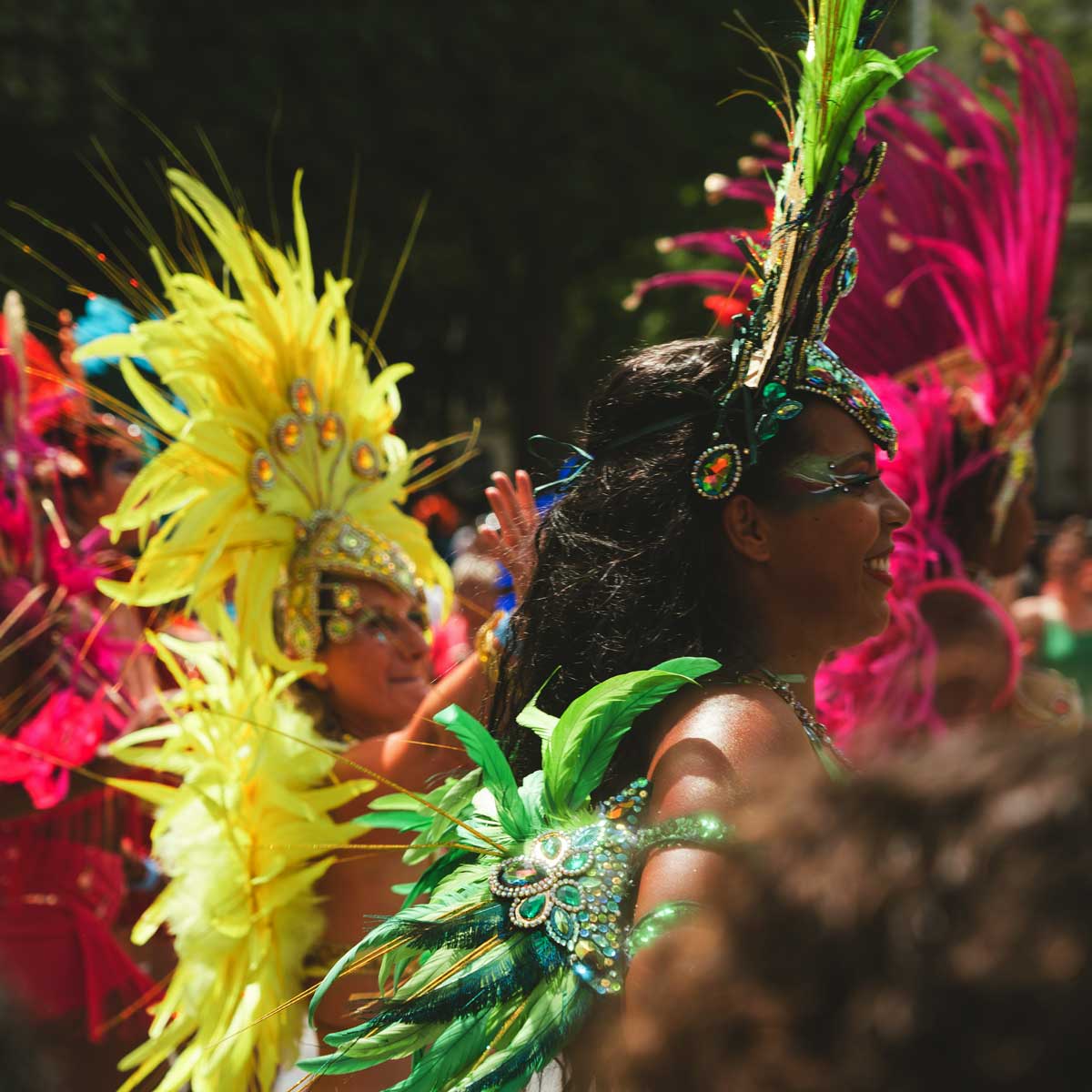 Rio Carnival, Brazilian women in feather and glitter costumes at the sambadrome