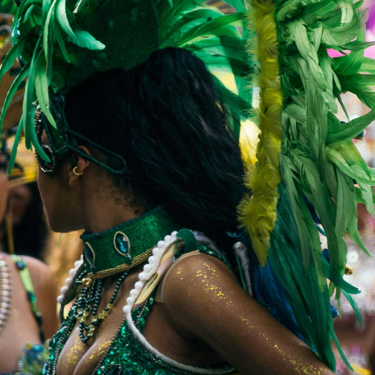 Rio Carnival, dancer in green feather costume at the sambadrome