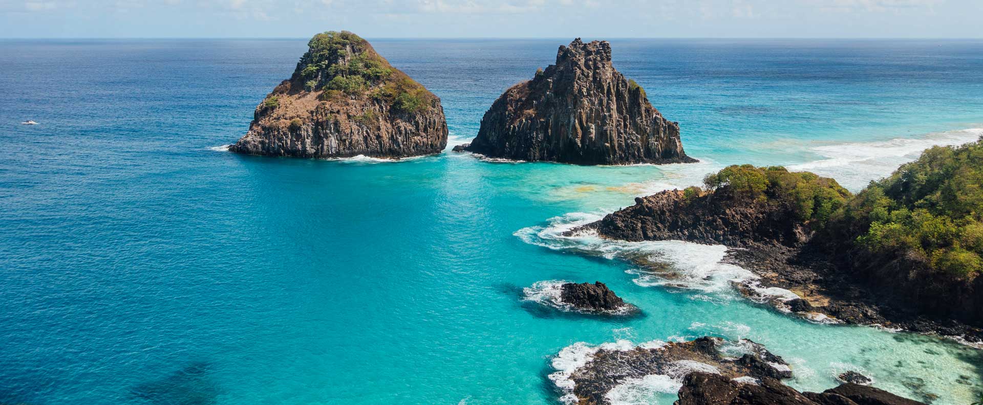 Panoramic view of Fernando de Noronha archipelago, Brazil – volcanic rocks, ocean and greenery, island tour with excursions