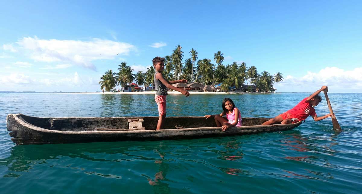Indians in a boat, Panama - traditional Kuna tribe canoe