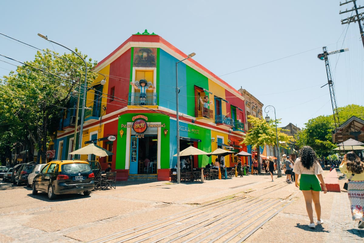 Colourful street corner in La Boca, Buenos Aires, with cafés and visitors