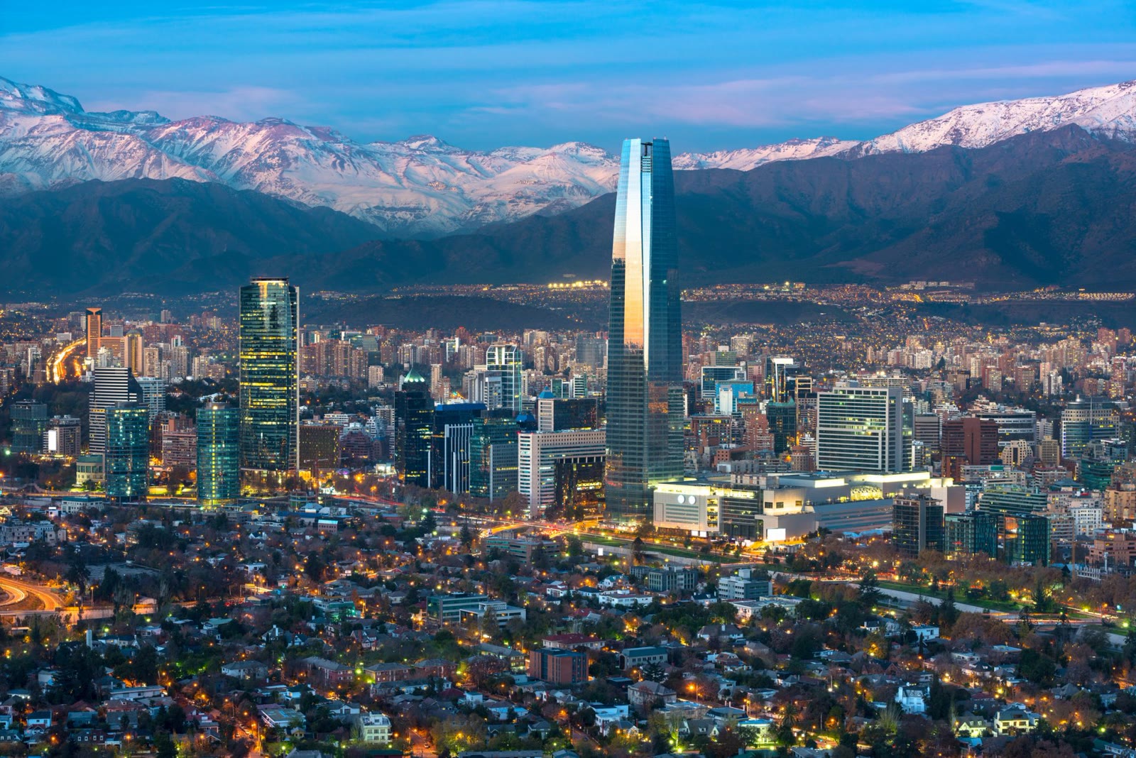 Santiago skyline at dusk with the Andes rising behind the city