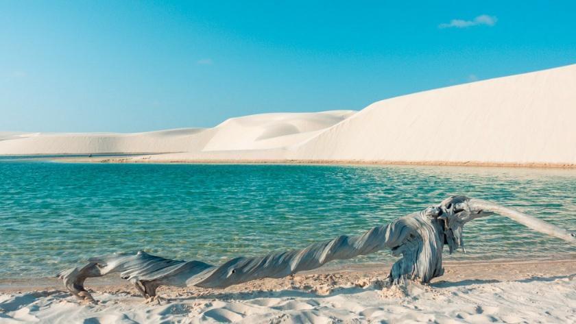 A dune-ringed turquoise lagoon in the Lençóis Maranhenses, Brazil.