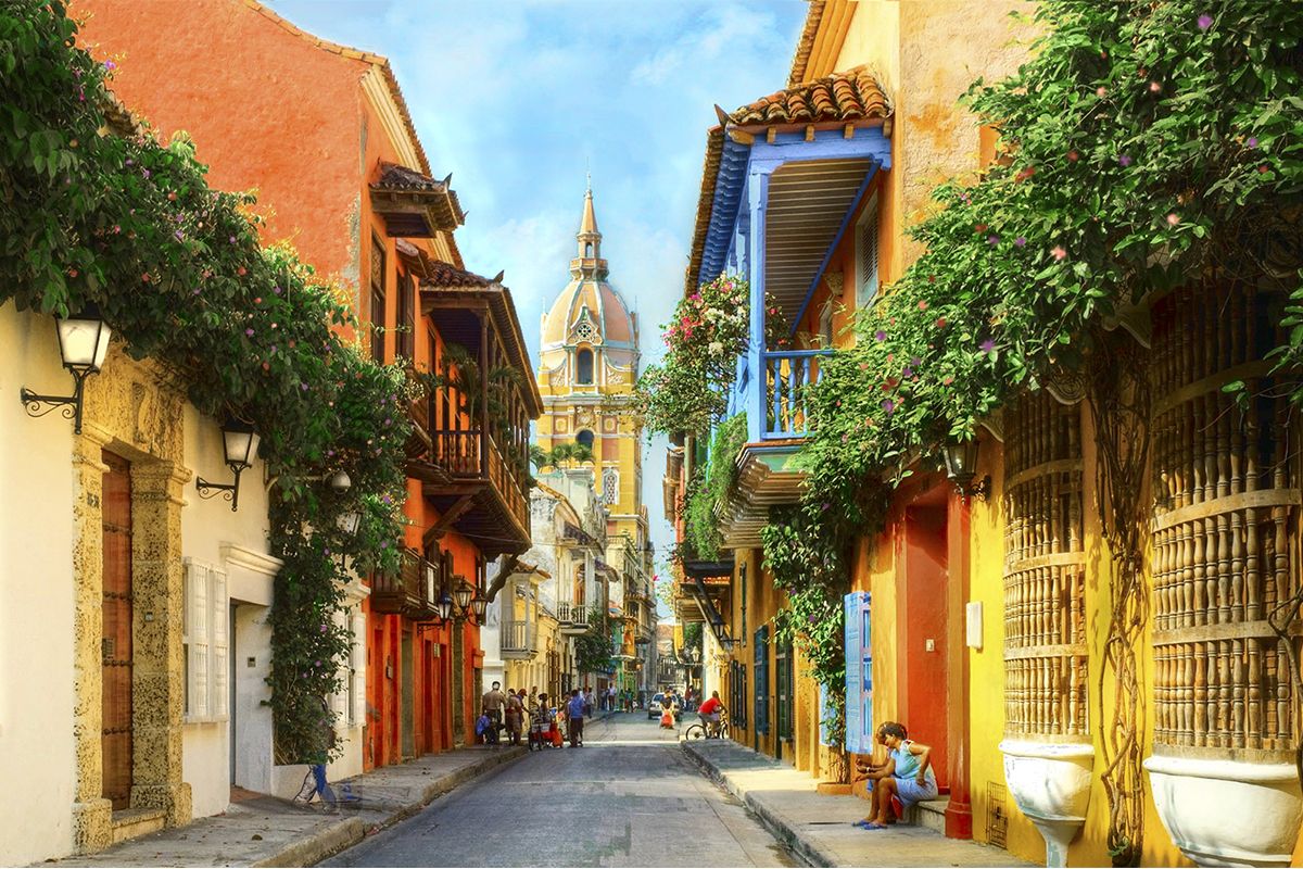 A sunlit street and historic buildings in Cartagena.